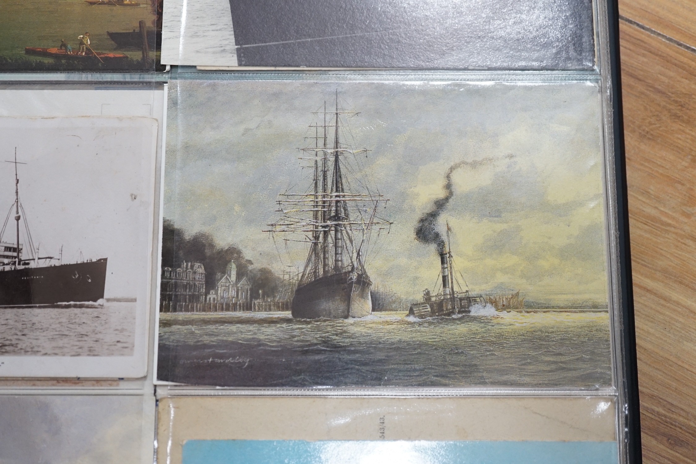 Three postcard albums with postcards relating to ships, royalty, art, trains, buses, motorcycles etc